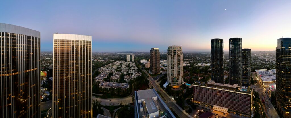 Panoramic city skyline with skyscrapers at dusk