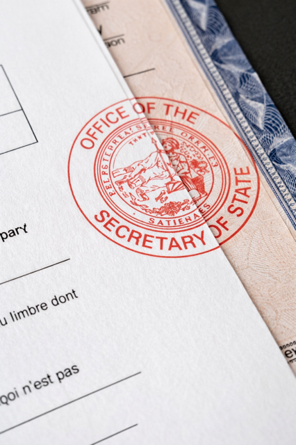 Red Secretary of State seal on document