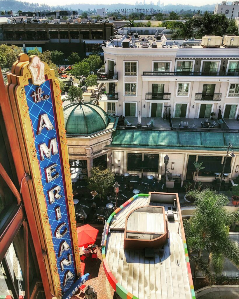 Americana sign overlooking courtyard and decorative boat