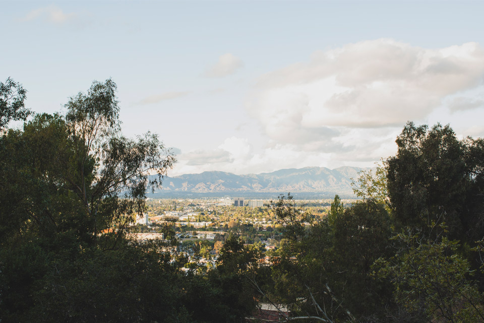 Hillside view of city valley and mountains
