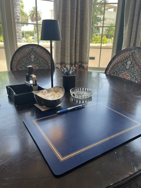 Desk with leather pad, pen, and accessories