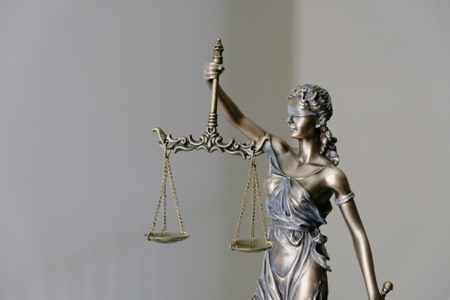 Scales of justice representing jail and detention center notary services for Prismark Signature Services.